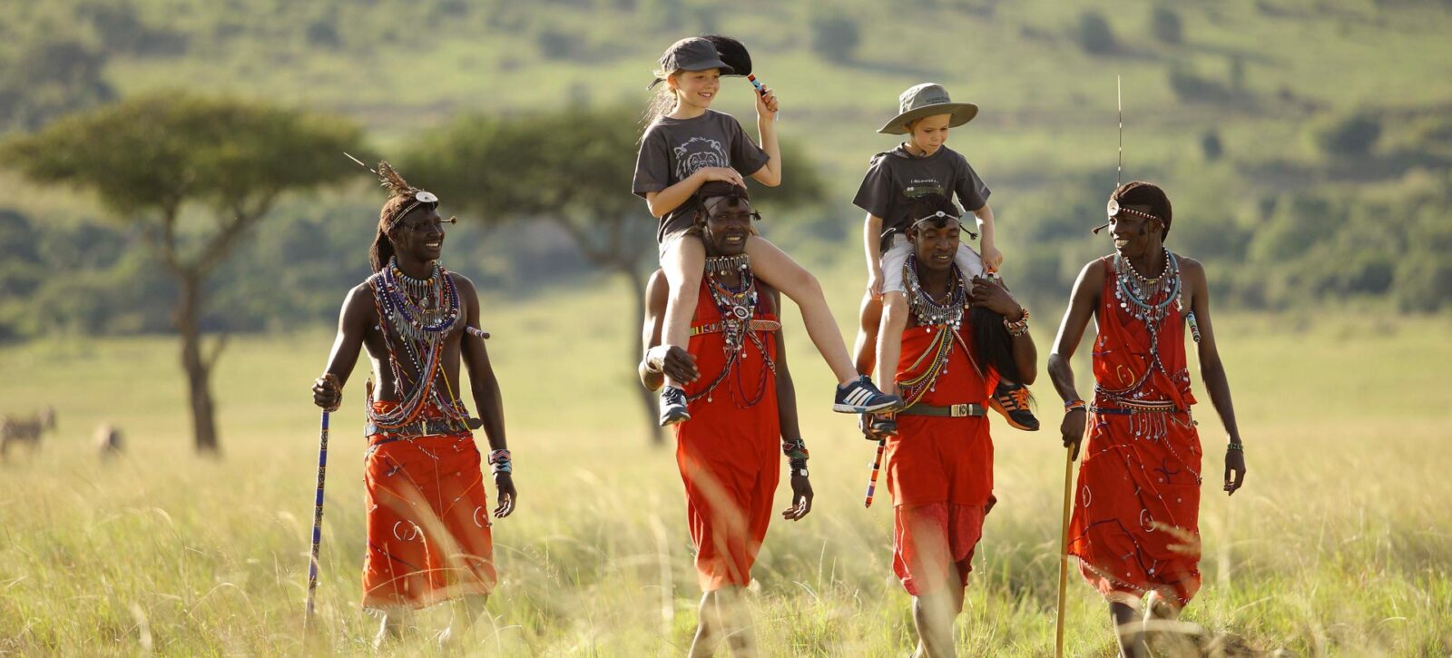 Masai-People-Carrying-Tourist-Kids-on-a-Tanzania-Safari